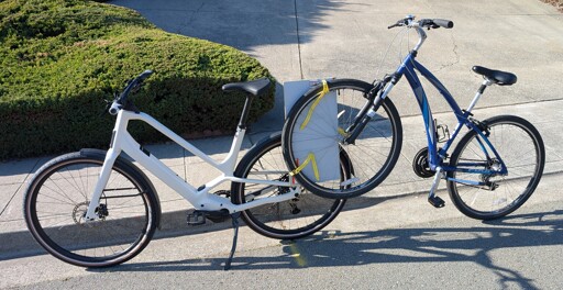 One bike attached to another bike for towing